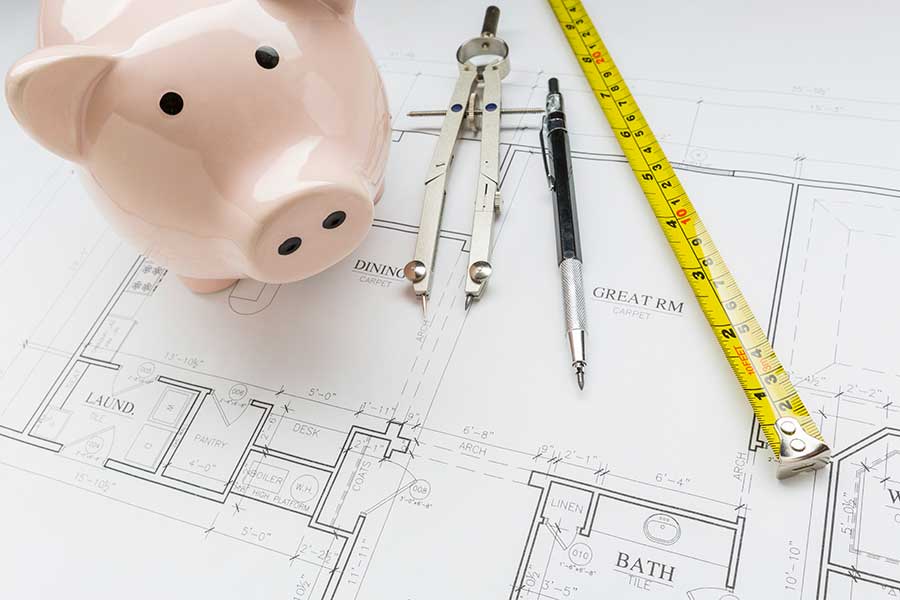 Piggy bank and architectural plans